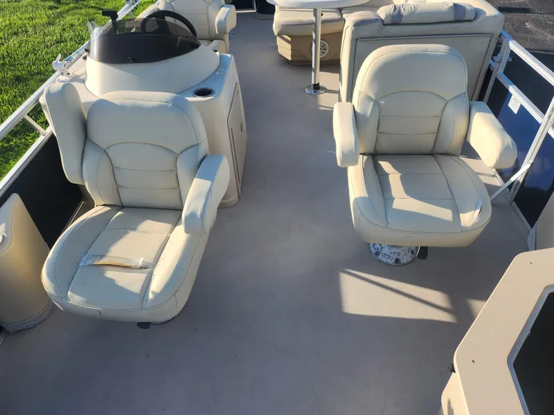 Slide: The Image of 2018 SunChaser Geneva Cruise 22 DLX 4.0 Fish boat interior with beige seating. - 10