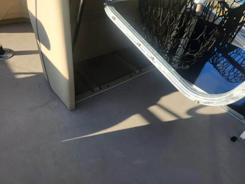 Slide: The Image of 2018 SunChaser Geneva Cruise 22 DLX 4.0 Fish boat interior with open storage compartment. - 14