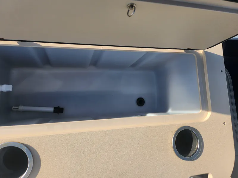 Slide: The Image of 2018 SunChaser Geneva Cruise 22 DLX 4.0 Fish boat storage compartment with cup holders. - 19