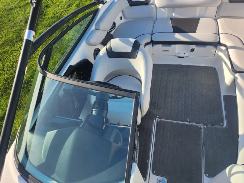 Slide: The Image of 2014 Yamaha Boats AR192 interior with seating and open windshield, showcasing sleek design. - 19