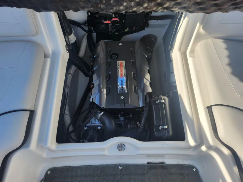 Slide: The Image of 2014 Yamaha Boats AR192 engine compartment, showcasing a clean and well-maintained motor. - 22