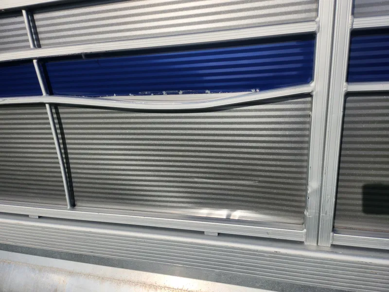 Slide: The Image of 2022 Bennington S 22 L-Bench pontoon boat with aluminum paneling detail. - 10