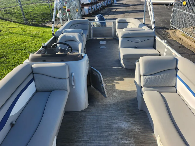 Slide: The Image of 2022 Bennington S 22 L-Bench pontoon boat with spacious seating and modern design. - 15