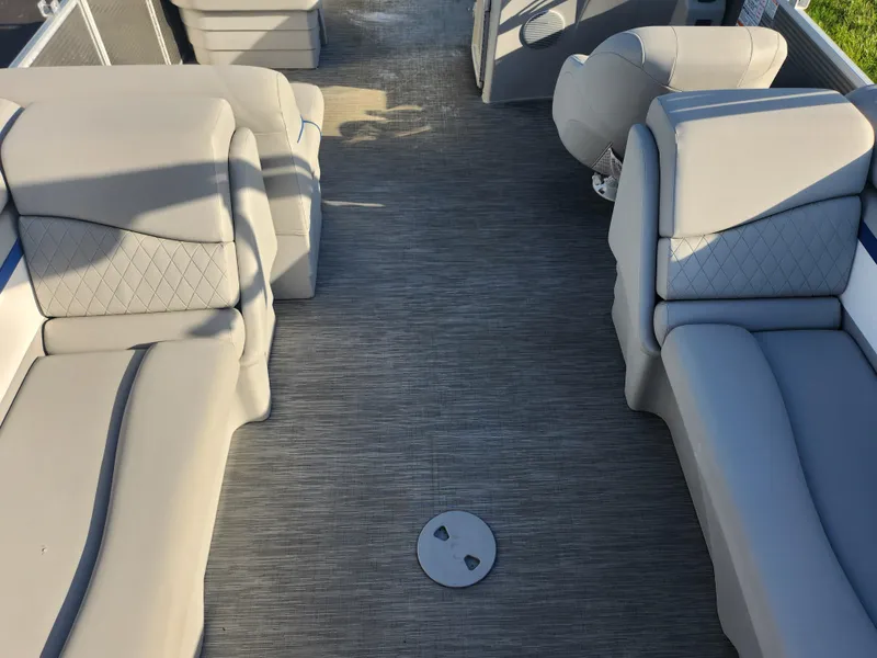 Slide: The Image of 2022 Bennington S 22 L-Bench interior with plush seating and spacious layout. - 23