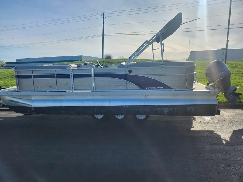 Slide: The Image of 2022 Bennington S 22 L-Bench pontoon boat with canopy and outboard motor. - 4