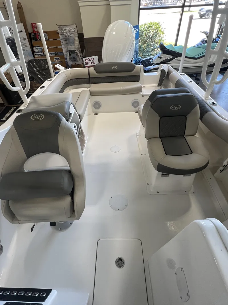 Slide: The Image of 2025 Key West Dual Console 239DFS interior with cushioned seating and spacious layout. - 6