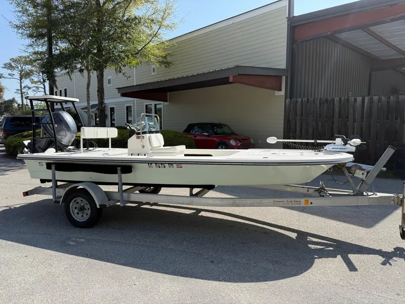 Slide: The Image of 2015 Spyder Boats FX17 FLICKER on trailer, parked outdoors near a building. - 1