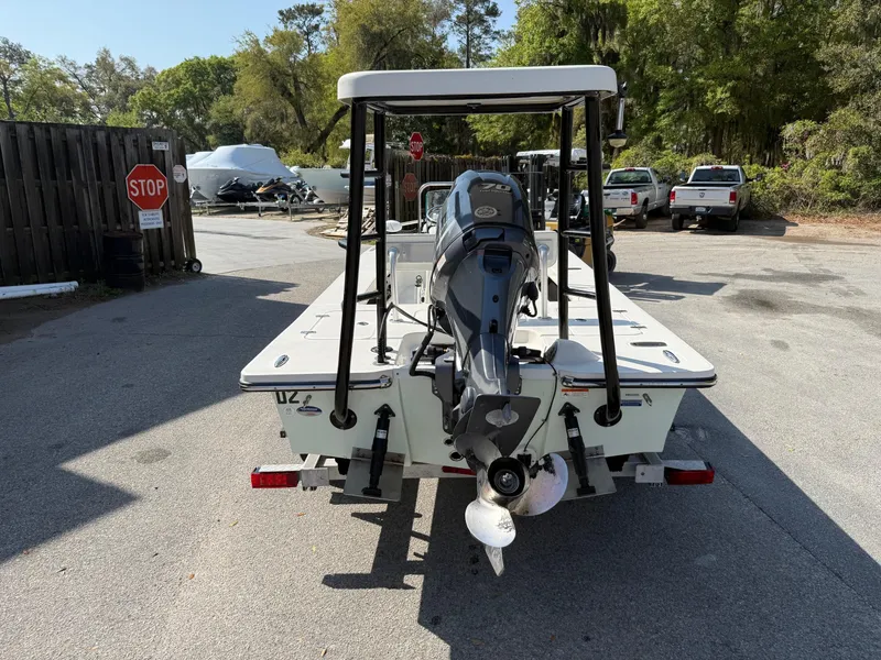 Slide: The Image of 2015 Spyder Boats FX17 FLICKER with outboard motor, parked in a lot. - 3