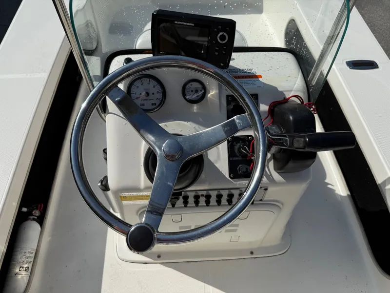 Slide: The Image of 2015 Spyder Boats FX17 FLICKER dashboard with steering wheel and controls. - 6