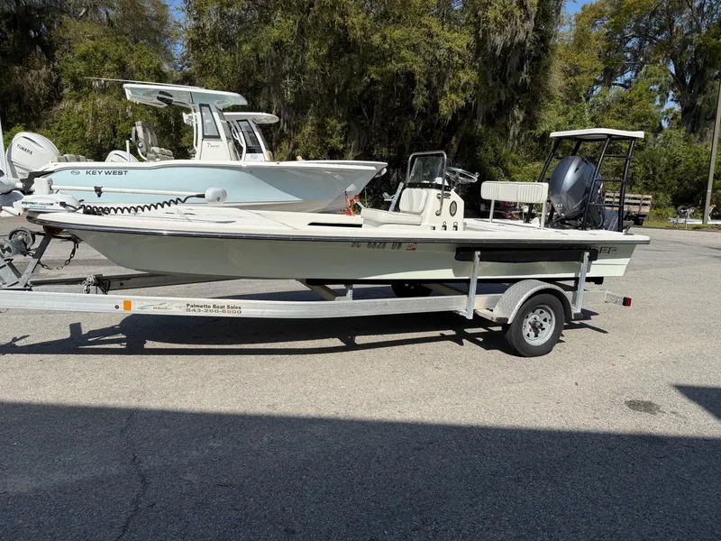 Slide: The Image of 2015 Spyder Boats FX17 FLICKER on trailer, parked outdoors. - 7