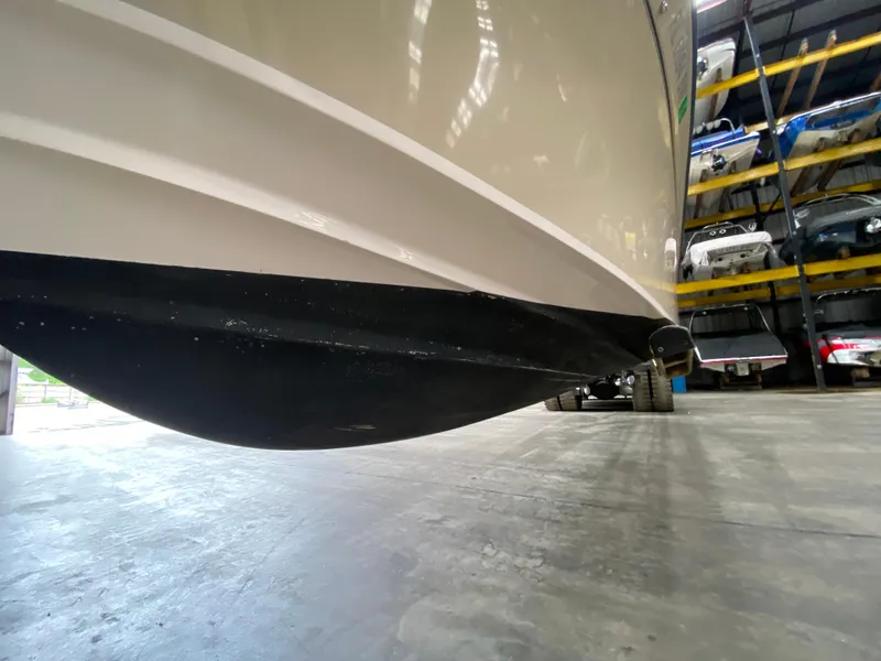 Slide: The Image of 2021 Grady-White Freedom 275 boat hull in storage facility. - 13