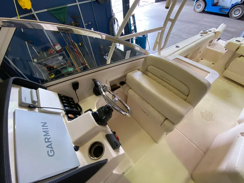 Slide: The Image of 2021 Grady-White Freedom 275 boat interior with Garmin navigation system. - 16