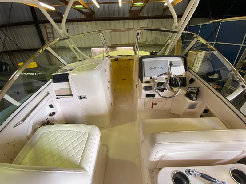 Slide: The Image of 2021 Grady-White Freedom 275 boat interior with Garmin navigation system. - 19