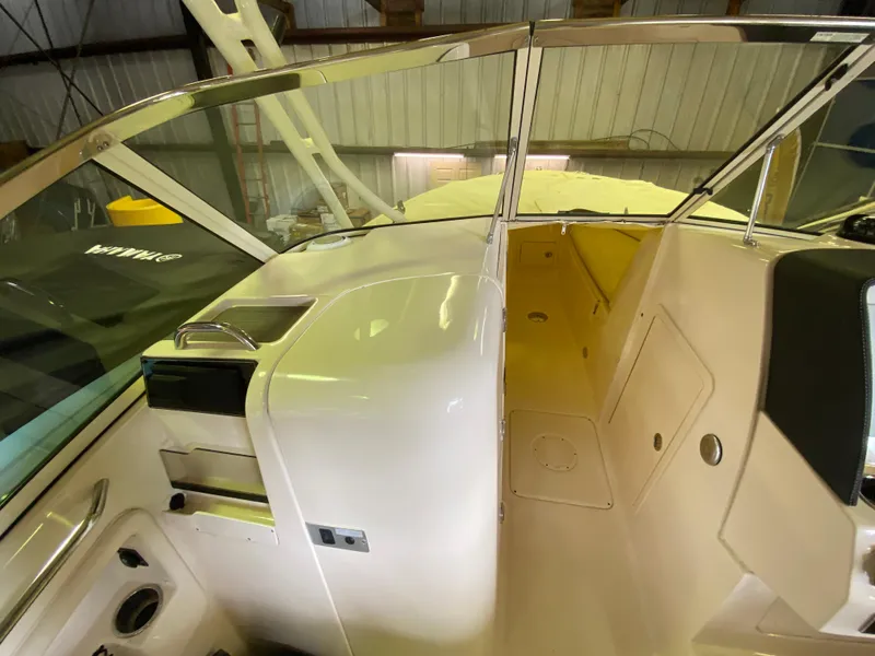 Slide: The Image of 2021 Grady-White Freedom 275 boat interior with seating and storage compartments. - 22