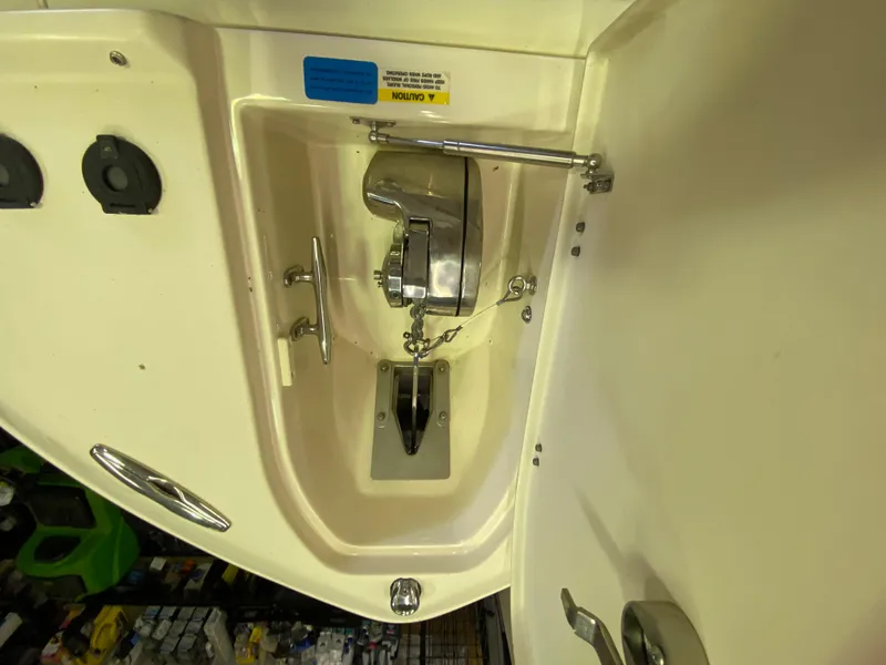 Slide: The Image of 2021 Grady-White Freedom 275 boat anchor compartment with stainless steel fittings. - 24