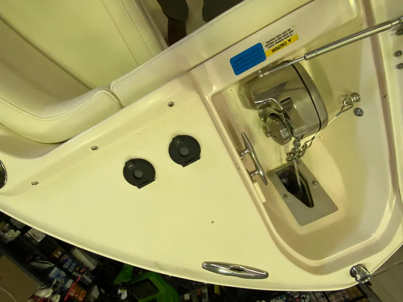 Slide: The Image of 2021 Grady-White Freedom 275 boat interior, featuring seating and control panel details. - 25