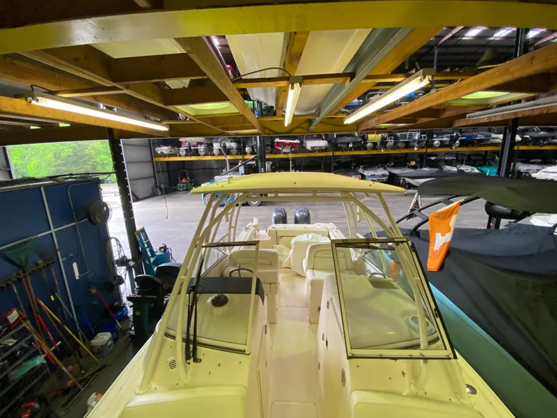 Slide: The Image of 2021 Grady-White Freedom 275 boat in indoor storage facility. - 27