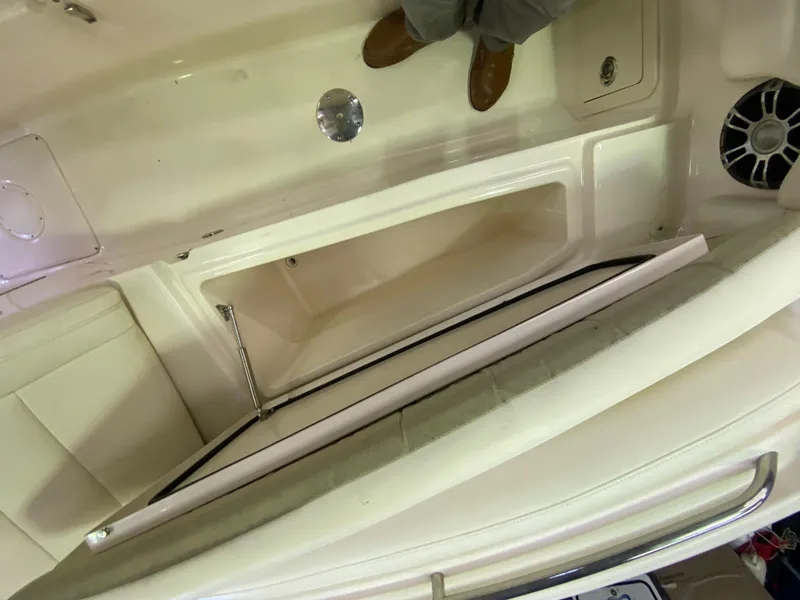 Slide: The Image of 2021 Grady-White Freedom 275 boat interior with open storage compartment. - 28