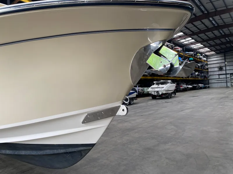Slide: The Image of 2021 Grady-White Freedom 275 boat in indoor storage facility. - 3