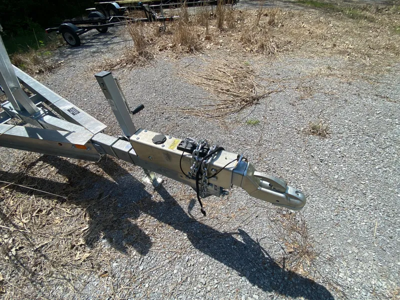Slide: The Image of Trailer hitch on gravel, suitable for 2021 Grady-White Freedom 275 boat. - 34