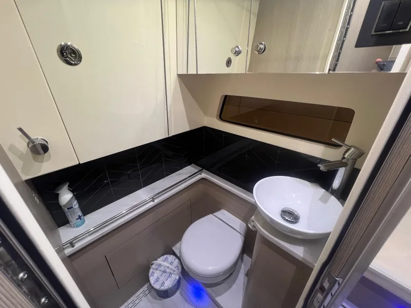Slide: The Image of 2024 Scout 377 LXF boat bathroom with modern fixtures and compact design. - 15
