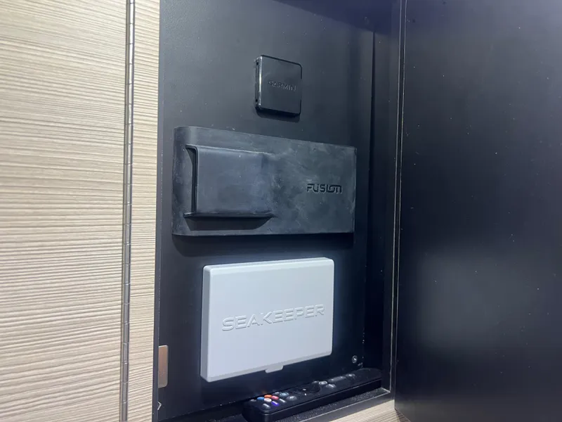 Slide: The Image of 2024 Scout 377 LXF control panel featuring Seakeeper and Fusion systems. - 18