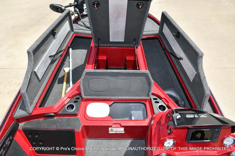 Slide: The Image of 2021 Nitro Z18 boat interior with storage compartments and fishing gear. - 10