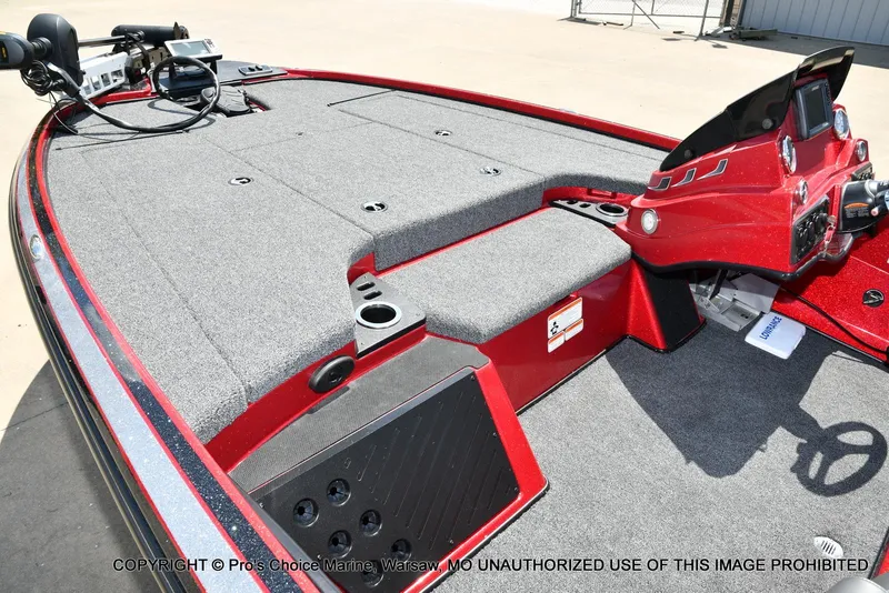 Slide: The Image of 2021 Nitro Z18 boat interior with red console and gray carpet. - 14