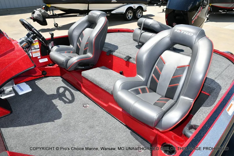 Slide: The Image of 2021 Nitro Z18 boat interior with gray and red seats, featuring a 150 Mercury Pro-XS engine. - 16