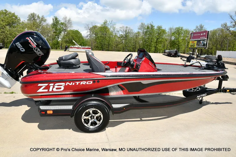 Slide: The Image of 2021 Nitro Z18 boat with 150 Mercury Pro-XS 4 Stroke engine, red and black design. - 21