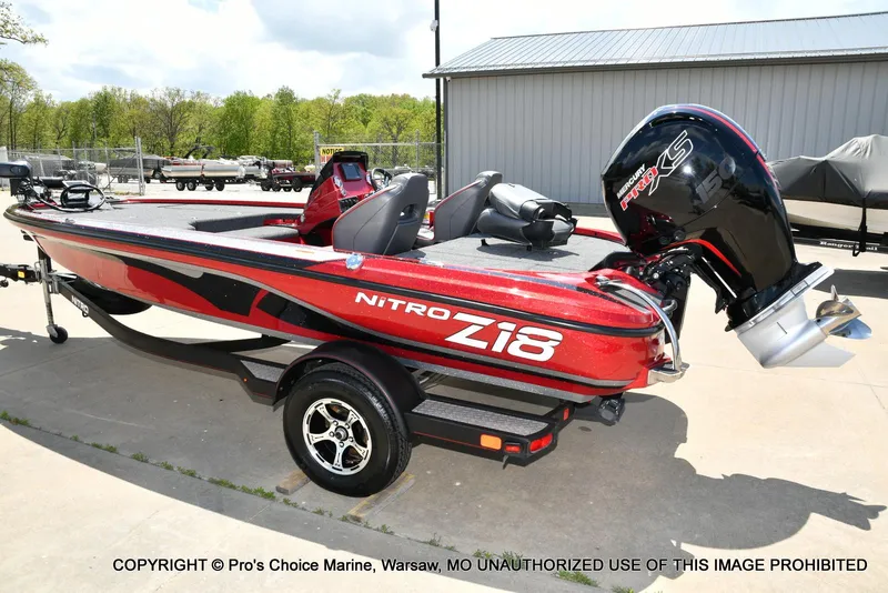 Slide: The Image of 2021 Nitro Z18 boat with 150 Mercury Pro-XS 4 Stroke engine, parked outdoors. - 27