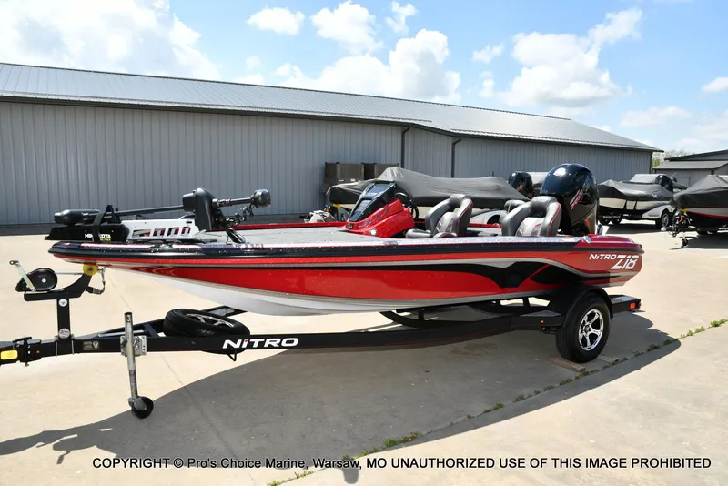 Slide: The Image of 2021 Nitro Z18 boat with 150 Mercury Pro-XS 4 Stroke engine, parked outdoors. - 29