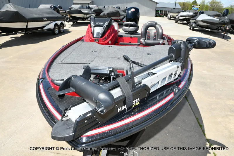 Slide: The Image of 2021 Nitro Z18 boat with Minn Kota Ultrex trolling motor, parked outdoors. - 31