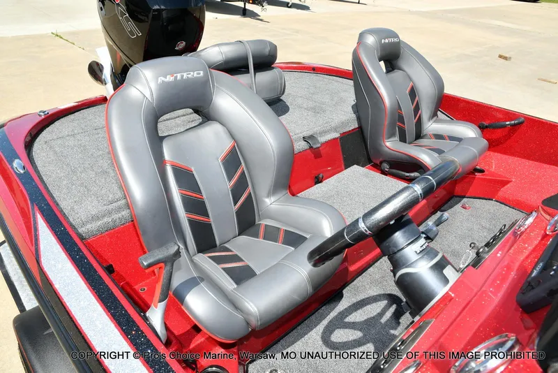 Slide: The Image of 2021 Nitro Z18 boat interior with gray and red seats, featuring a Mercury Pro-XS engine. - 37