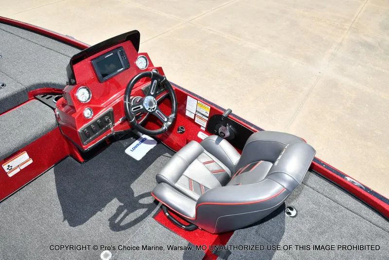 Slide: The Image of 2021 Nitro Z18 boat interior with steering wheel and dashboard controls. - 43