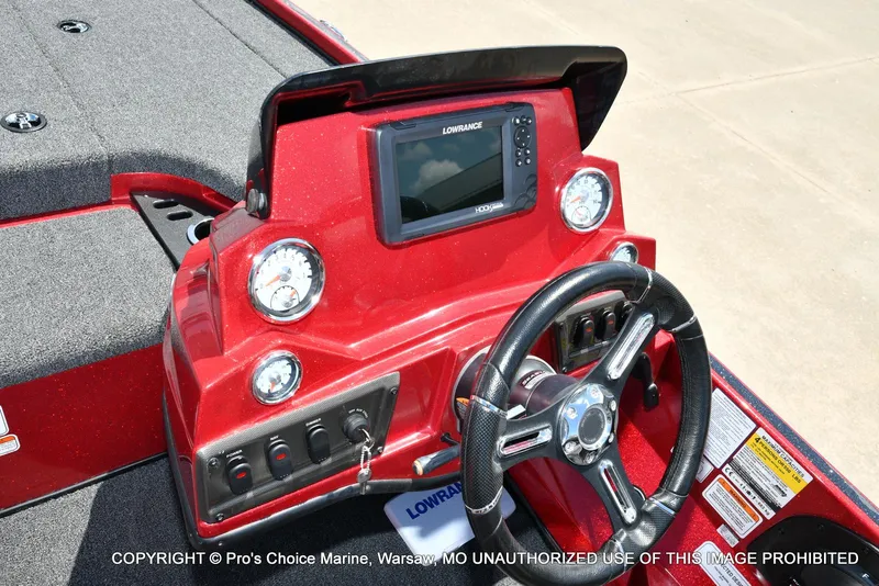 Slide: The Image of Red 2021 Nitro Z18 boat dashboard with Lowrance display and steering wheel. - 45