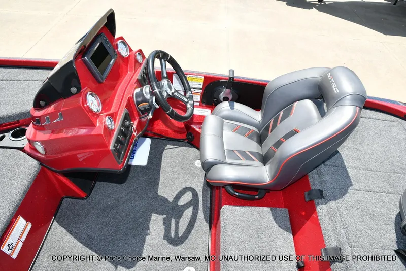 Slide: The Image of 2021 Nitro Z18 boat interior with steering console and cushioned seat. - 46