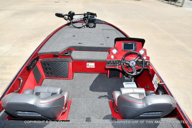 Slide: The Image of 2021 Nitro Z18 boat interior with steering console and seating, featuring a Lowrance system. - 9