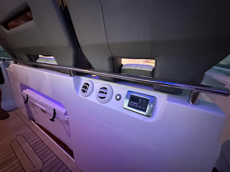 Slide: The Image of Tiara Yachts 2020 43 LS interior with seating, control panel, and storage compartment. - 29