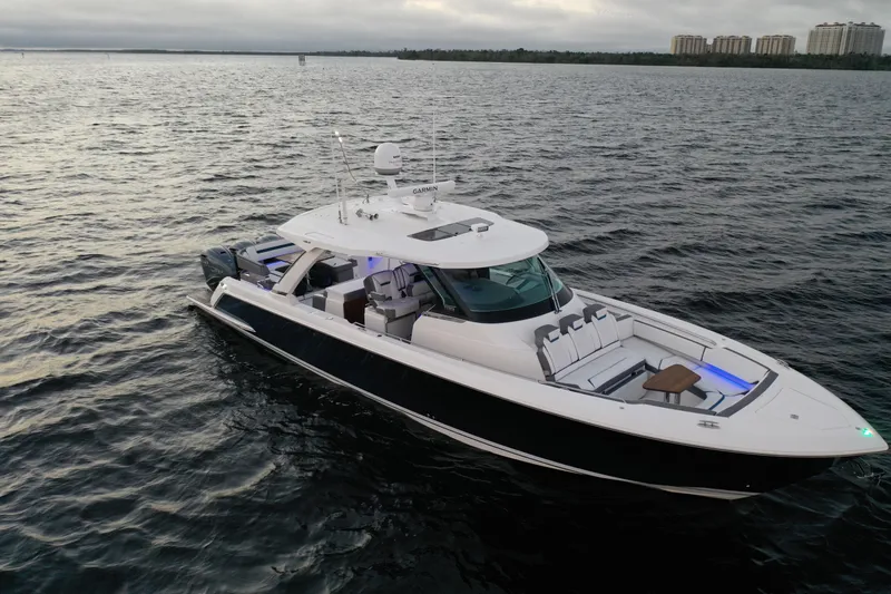 Slide: The Image of 2020 Tiara Yachts 43 LS cruising on open water at sunset. - 3