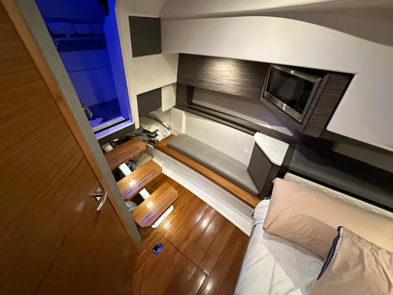 Slide: The Image of Interior of 2020 Tiara Yachts 43 LS, featuring modern design and wooden flooring. - 32
