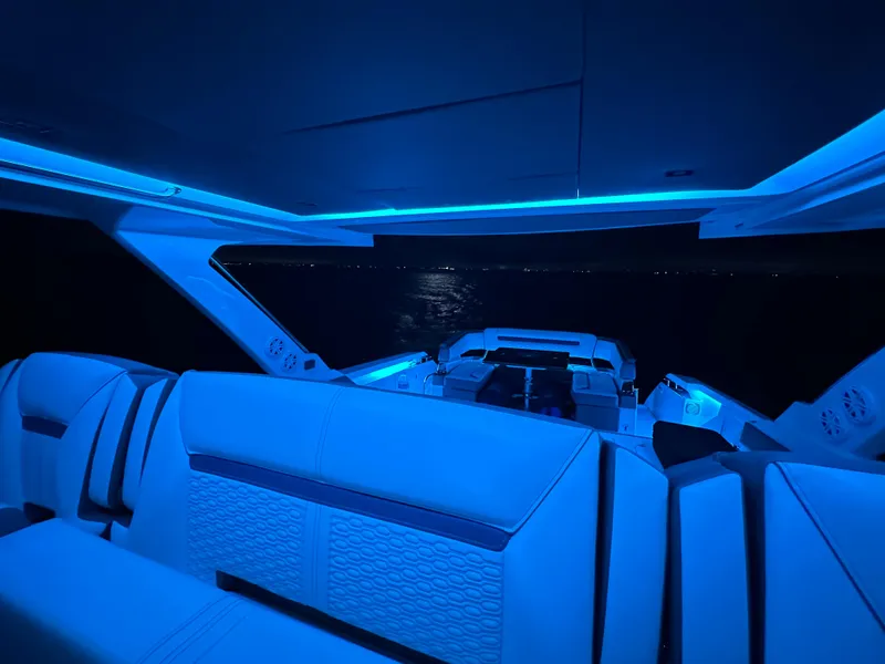 Slide: The Image of 2020 Tiara Yachts 43 LS interior with blue ambient lighting at night. - 40