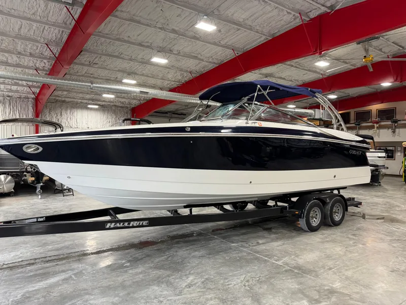 Slide: The Image of 2002 Cobalt 282 BR boat on trailer in indoor storage facility. - 1