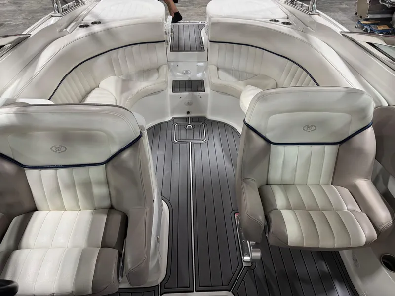 Slide: The Image of Interior of a 2002 Cobalt 282 BR boat with white leather seating. - 12