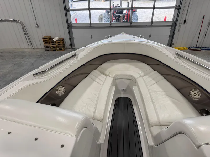 Slide: The Image of Interior view of a 2002 Cobalt 282 BR boat, featuring white seating and sleek design. - 13