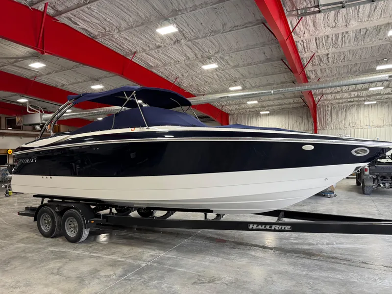 Slide: The Image of 2002 Cobalt 282 BR boat on trailer in indoor storage facility. - 18