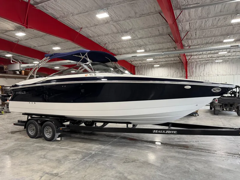 Slide: The Image of 2002 Cobalt 282 BR boat on trailer in indoor storage facility. - 2