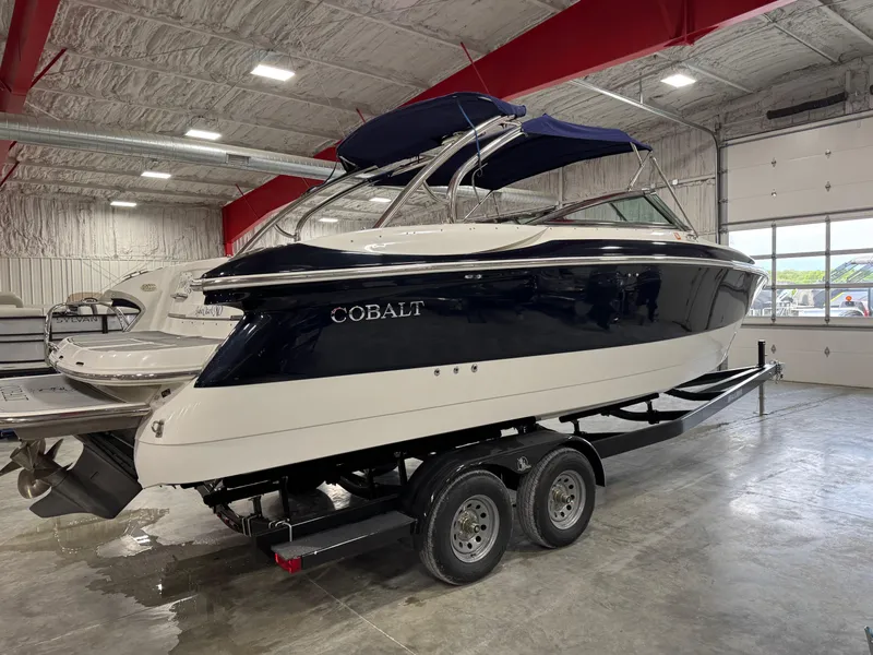 Slide: The Image of 2002 Cobalt 282 BR boat on trailer in indoor storage facility. - 4