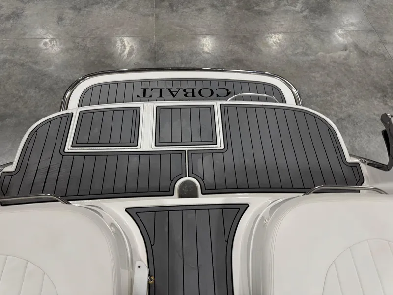 Slide: The Image of 2002 Cobalt 282 BR boat deck with sleek black and white design. - 6