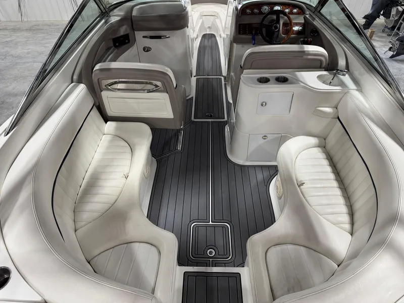 Slide: The Image of Interior of a 2002 Cobalt 282 BR boat with white seating and sleek design. - 7